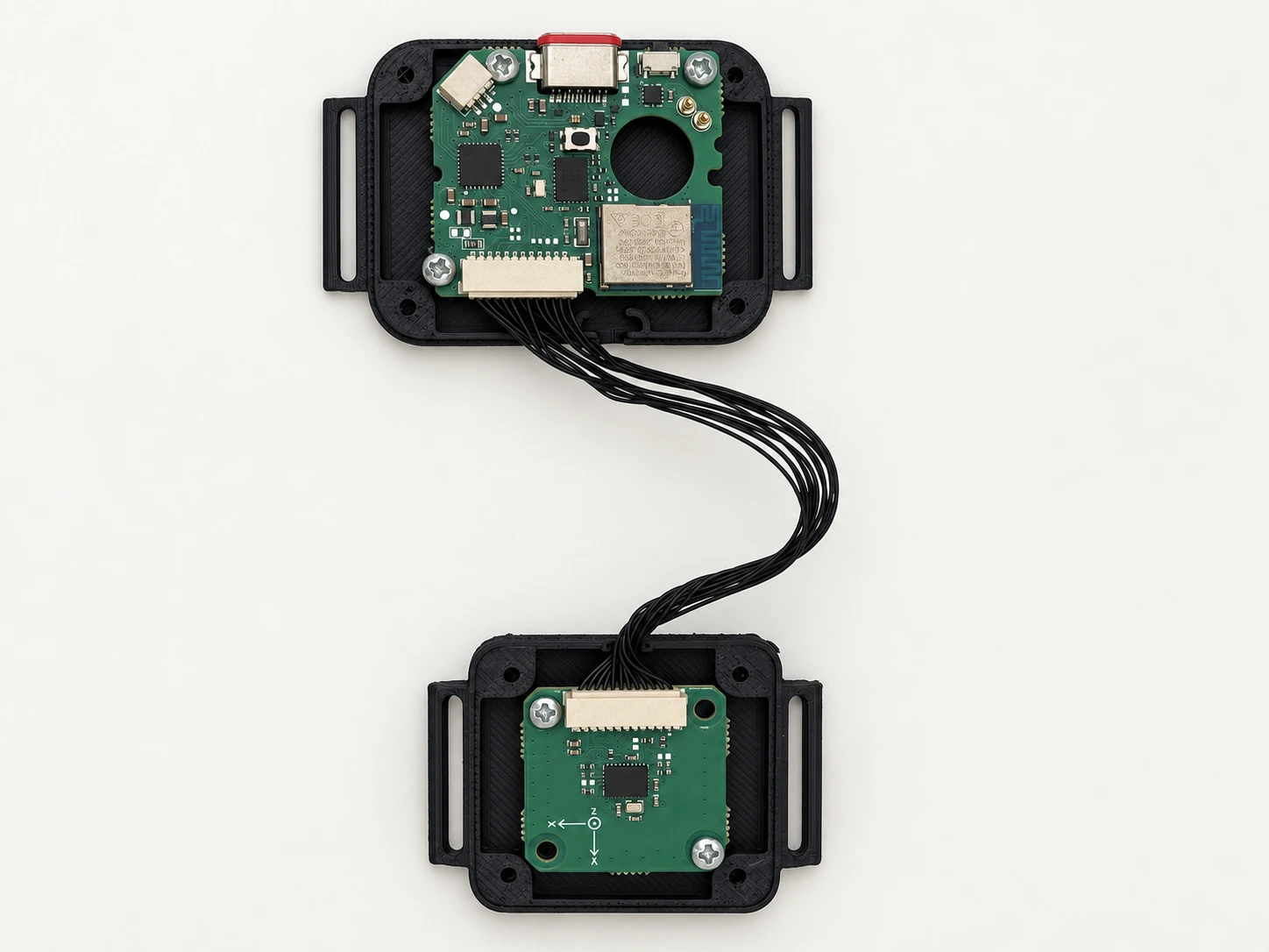 Open wrist and hand modules showing both custom circuit boards and the complete cable